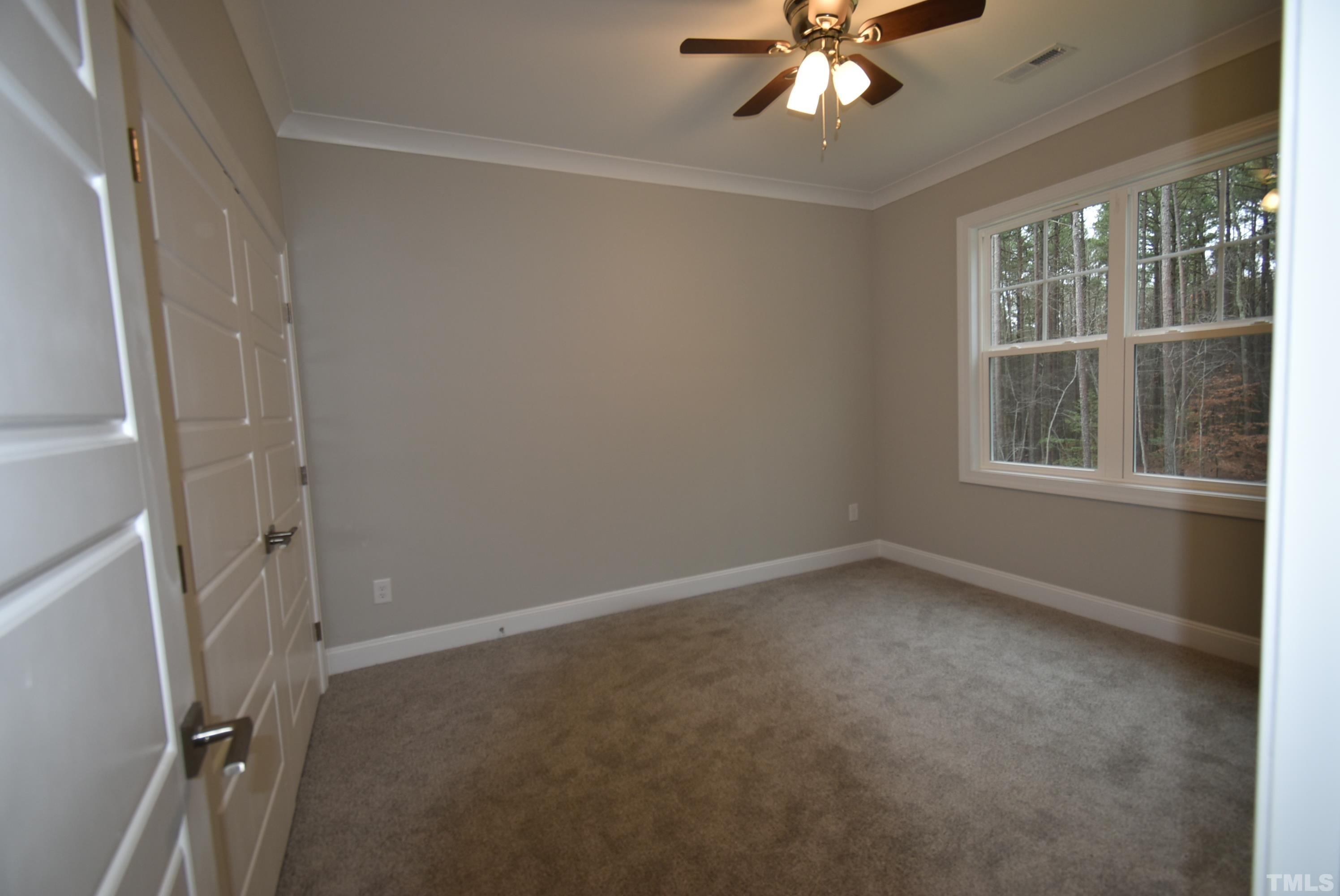 6237 Reagan Lane Wake Forest, NC 27587 - Photo 13 of 22 an empty room with a window and a fan