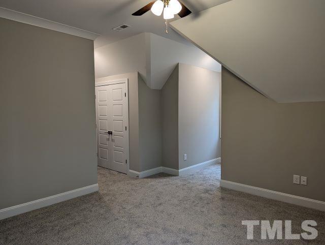 6237 Reagan Lane Wake Forest, NC 27587 - Photo 15 of 22 an empty room with a ceiling fan and closet area
