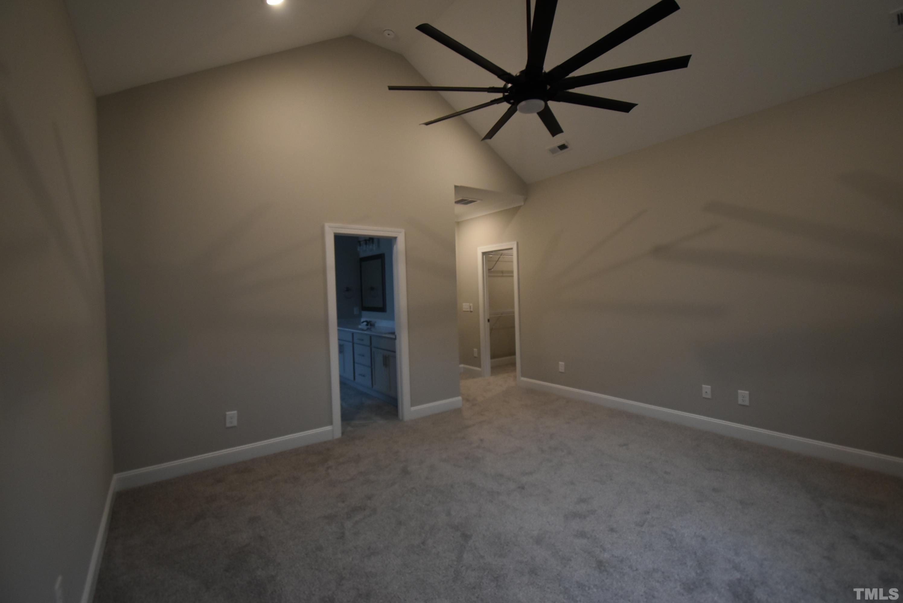 6237 Reagan Lane Wake Forest, NC 27587 - Photo 16 of 22 an empty room with a ceiling fan and a ceiling fan