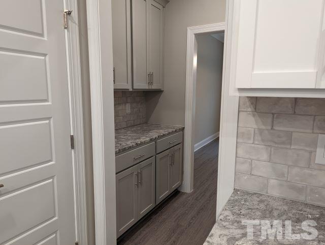 6237 Reagan Lane Wake Forest, NC 27587 - Photo 4 of 22 a kitchen with white cabinets and counter space