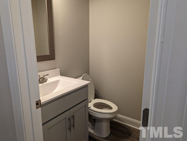 6237 Reagan Lane Wake Forest, NC 27587 - Photo 10 of 22 a bathroom with a sink a toilet and a mirror