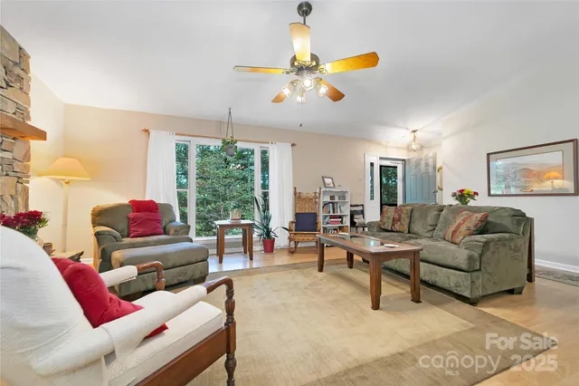 a view of a dining room with furniture wooden floor and chandelier