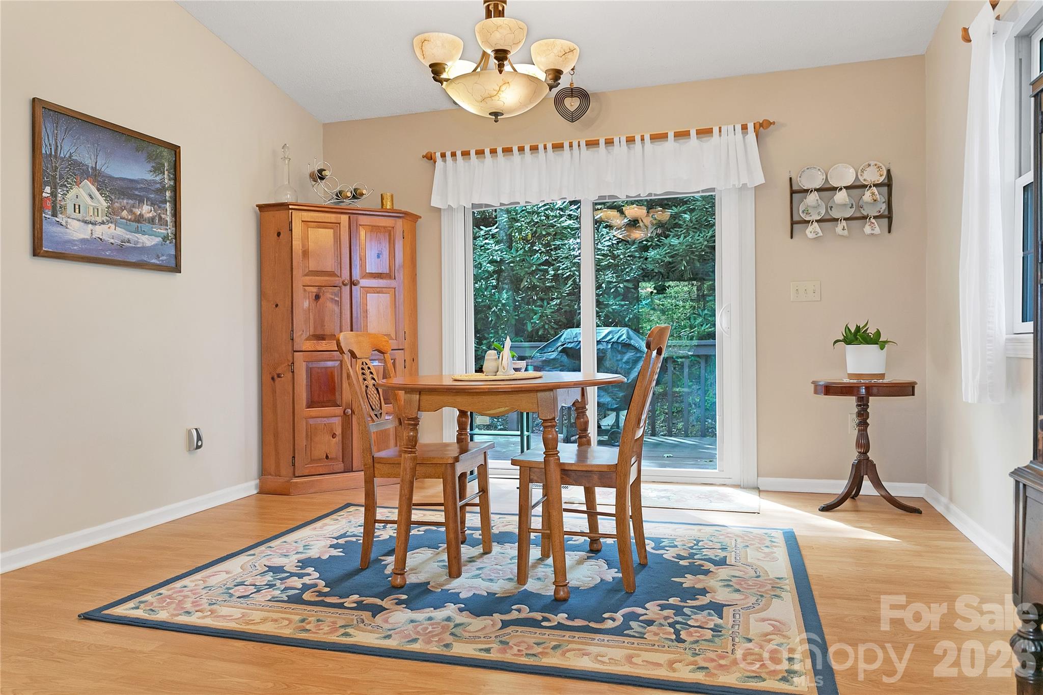239 Three Mile Knob Road Pisgah Forest, NC 28768 - Photo 14 of 48 a view of a dining room with furniture window and wooden floor