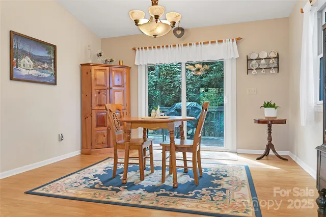 a kitchen with stainless steel appliances granite countertop a refrigerator stove and sink