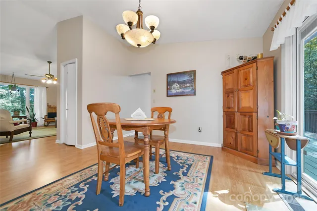 a kitchen with stainless steel appliances granite countertop a stove microwave and cabinets