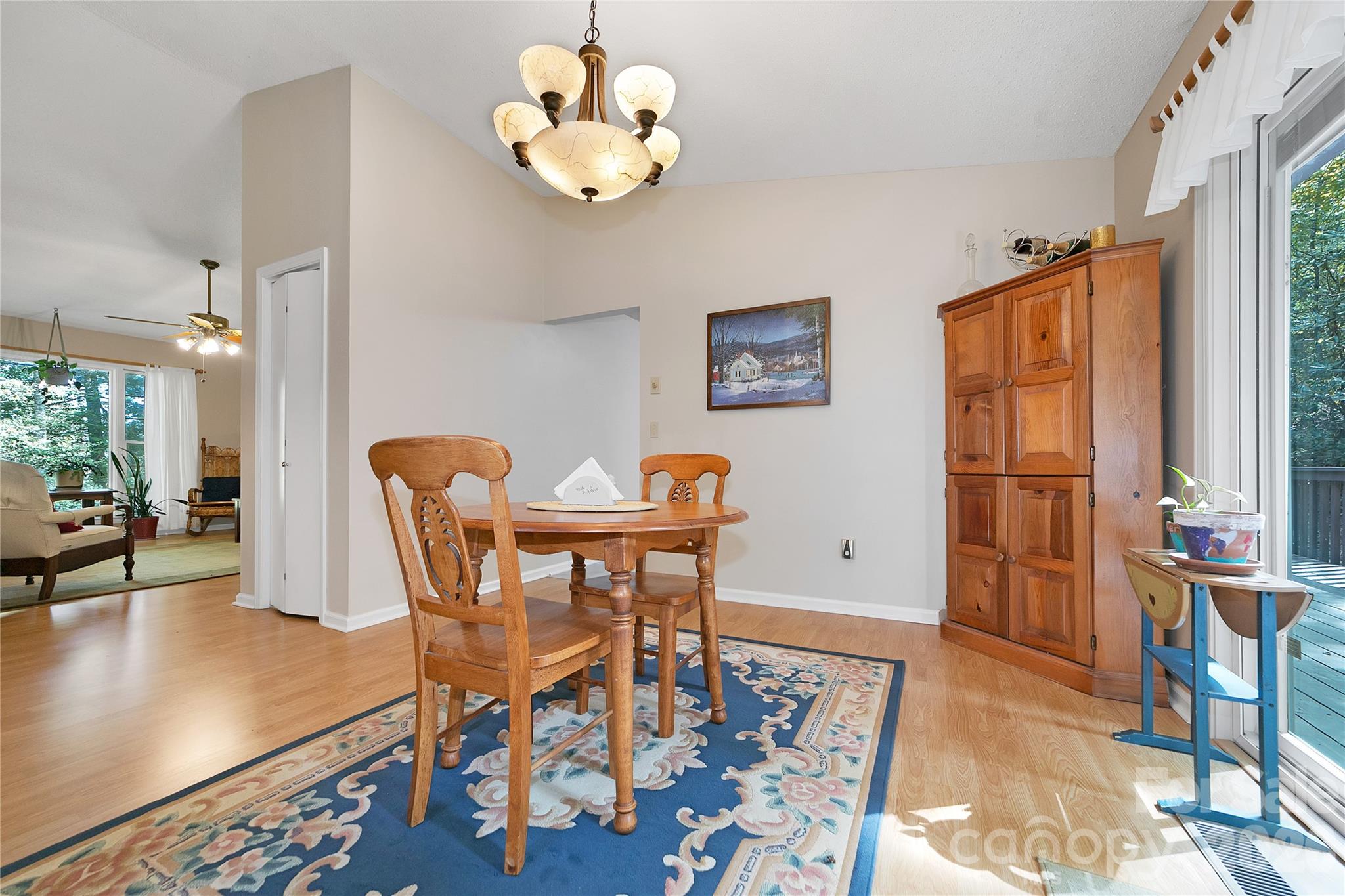 239 Three Mile Knob Road Pisgah Forest, NC 28768 - Photo 15 of 48 a view of a dining room with furniture and chandelier