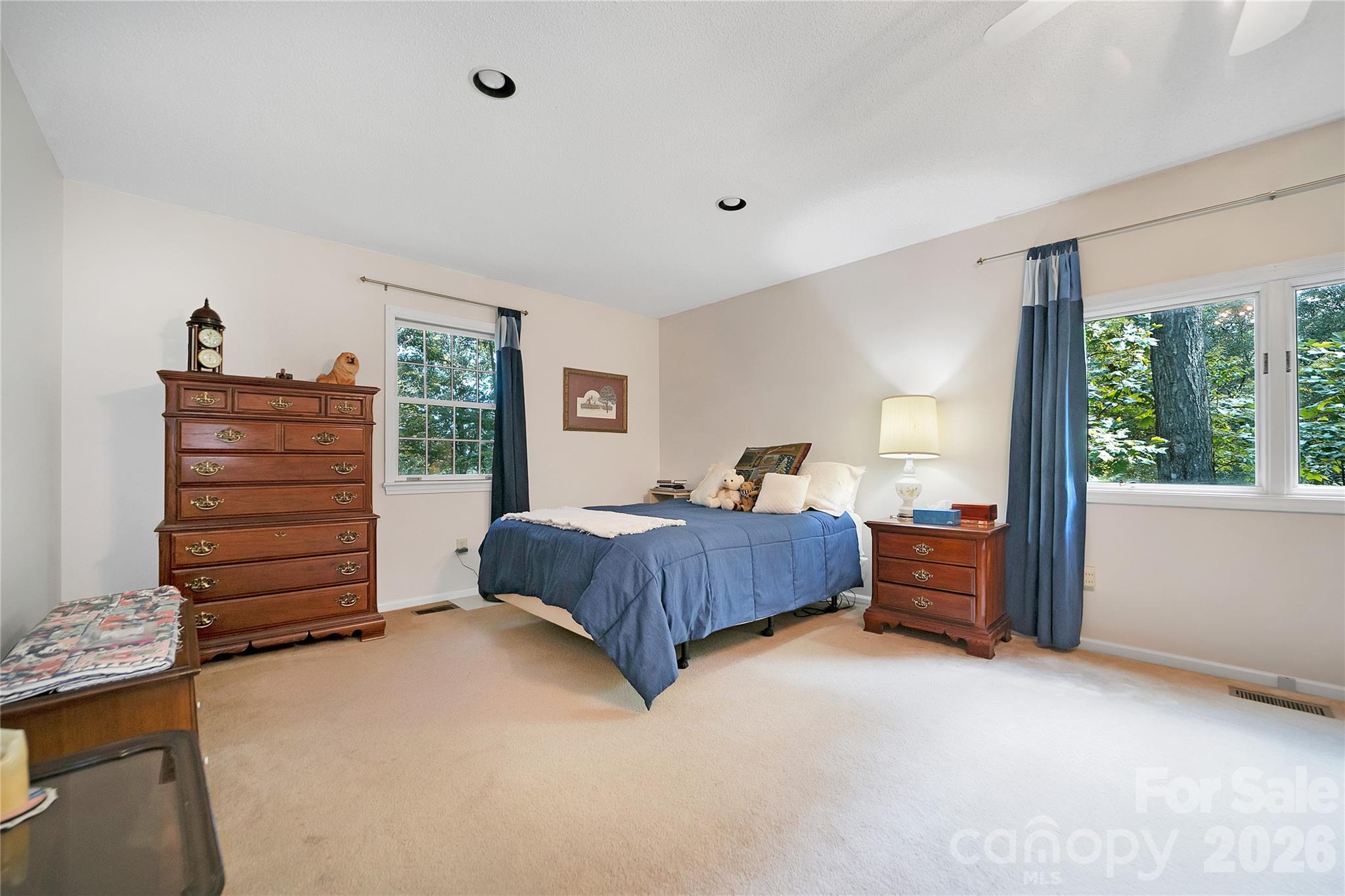 239 Three Mile Knob Road Pisgah Forest, NC 28768 - Photo 22 of 48 a bedroom with a bed and a dresser