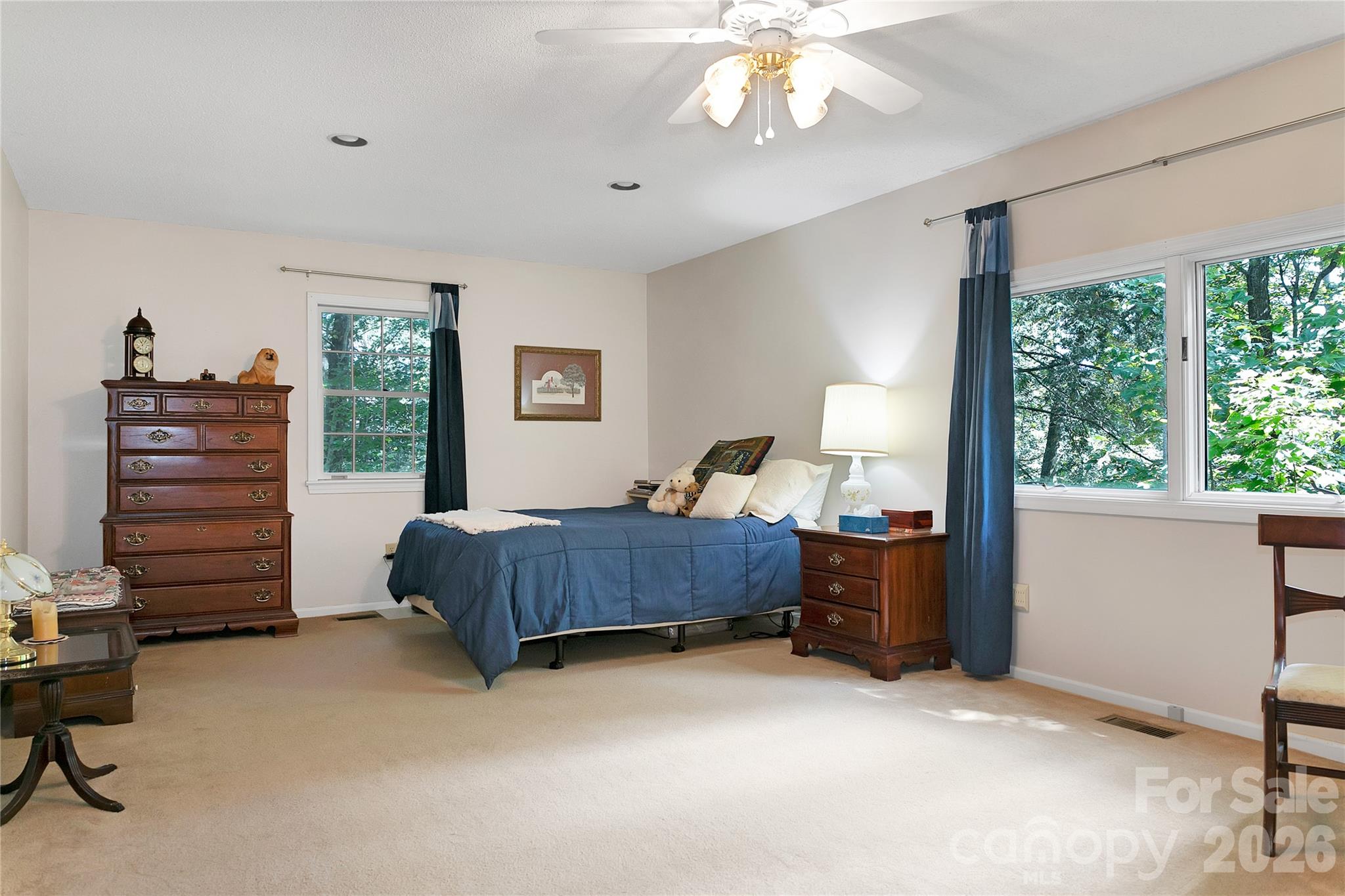 239 Three Mile Knob Road Pisgah Forest, NC 28768 - Photo 25 of 48 a bedroom with a bed and a chandelier