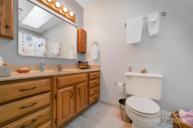 a bathroom with a toilet and a sink