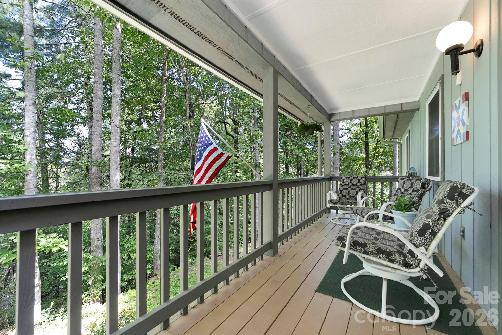 239 Three Mile Knob Road Pisgah Forest, NC 28768 - Photo 3 of 48 a view of a chair and tables in the balcony