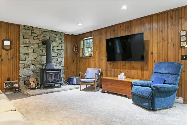 a bedroom with a bed and a ceiling fan