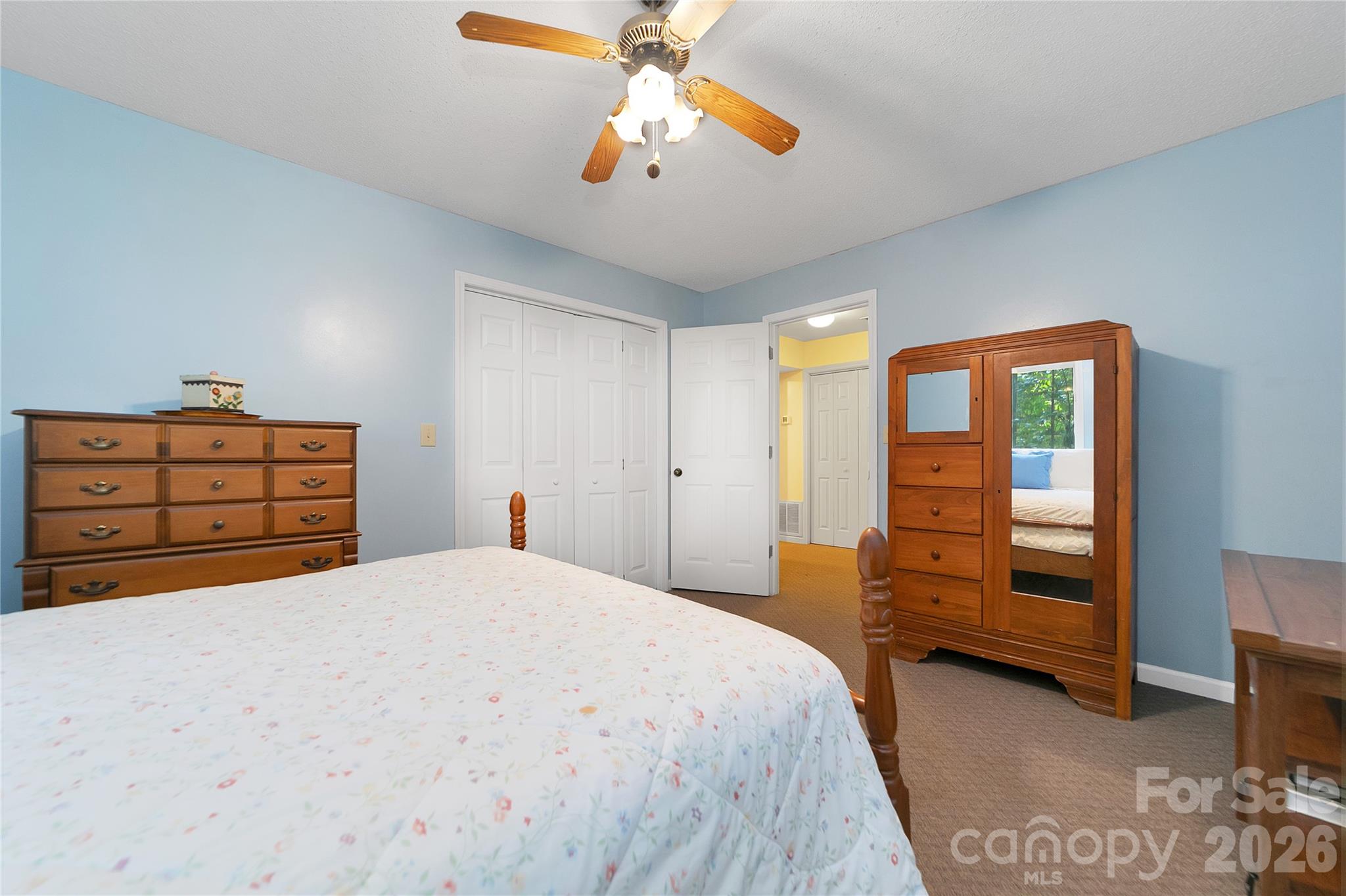 239 Three Mile Knob Road Pisgah Forest, NC 28768 - Photo 41 of 48 a bedroom with a bed and a closet