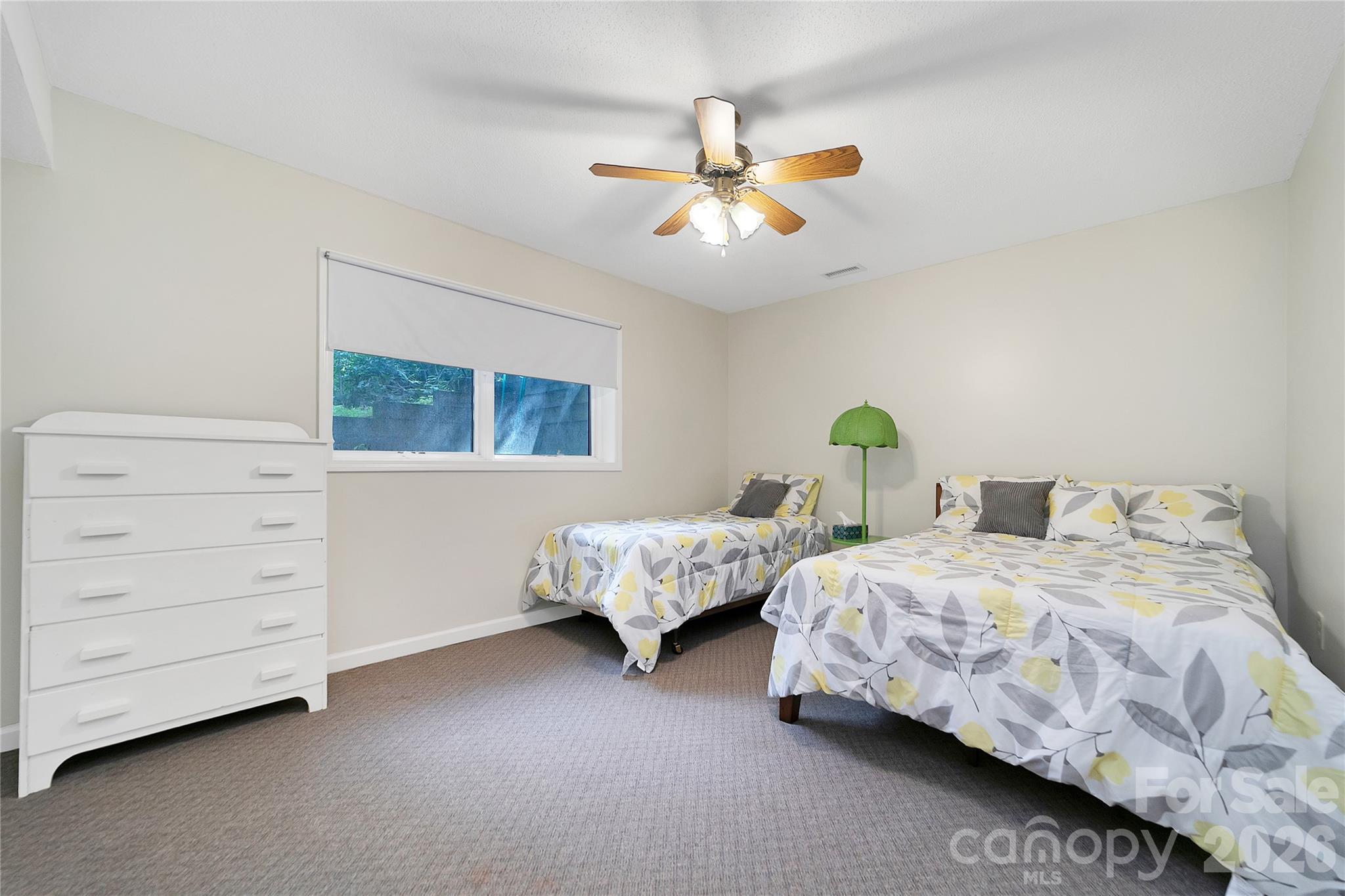 239 Three Mile Knob Road Pisgah Forest, NC 28768 - Photo 43 of 48 a bedroom with two beds and ceiling fan