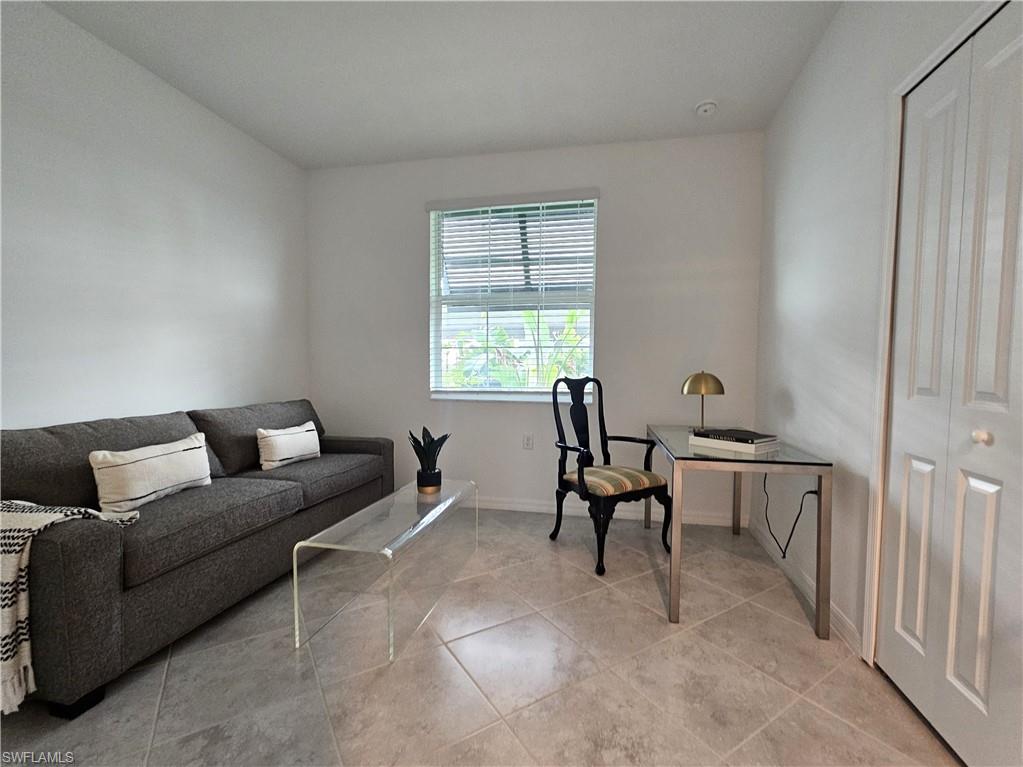 5835 Double Eagle Circle, Unit 4711 Immokalee, FL 34142 - Photo 16 of 44 a living room with furniture and a window