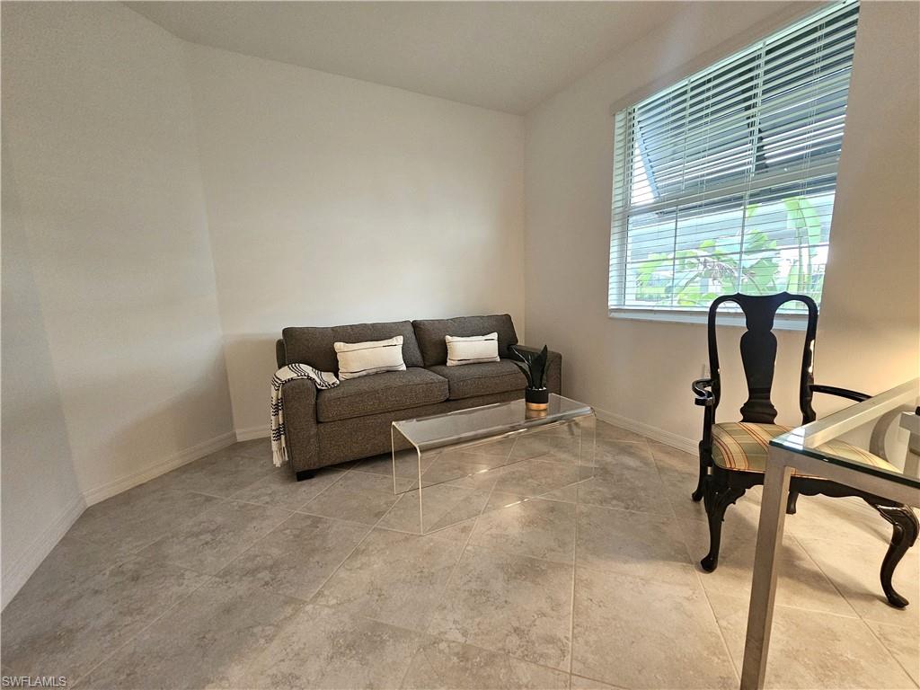 5835 Double Eagle Circle, Unit 4711 Immokalee, FL 34142 - Photo 17 of 44 a bedroom with furniture and a window