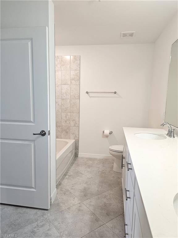 5835 Double Eagle Circle, Unit 4711 Immokalee, FL 34142 - Photo 19 of 44 a bathroom with a sink a toilet and shower