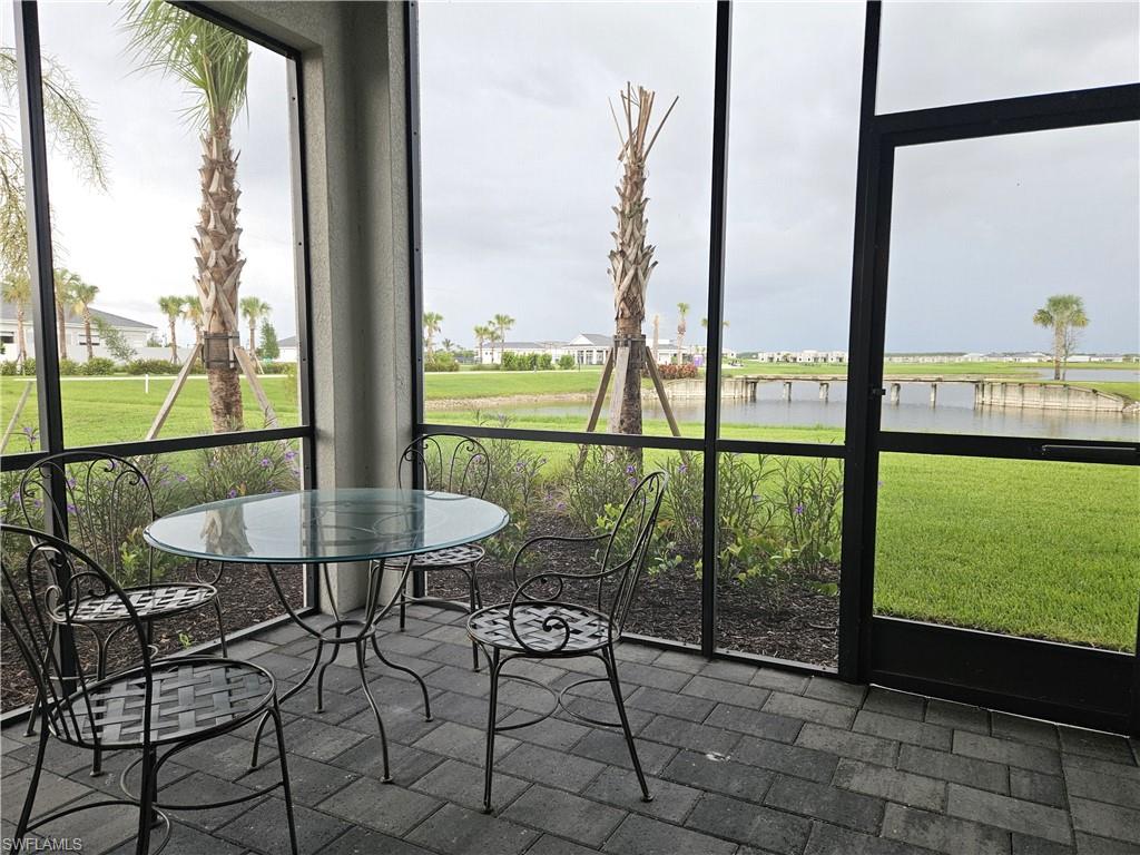 5835 Double Eagle Circle, Unit 4711 Immokalee, FL 34142 - Photo 23 of 44 a view of a room with a table and chairs