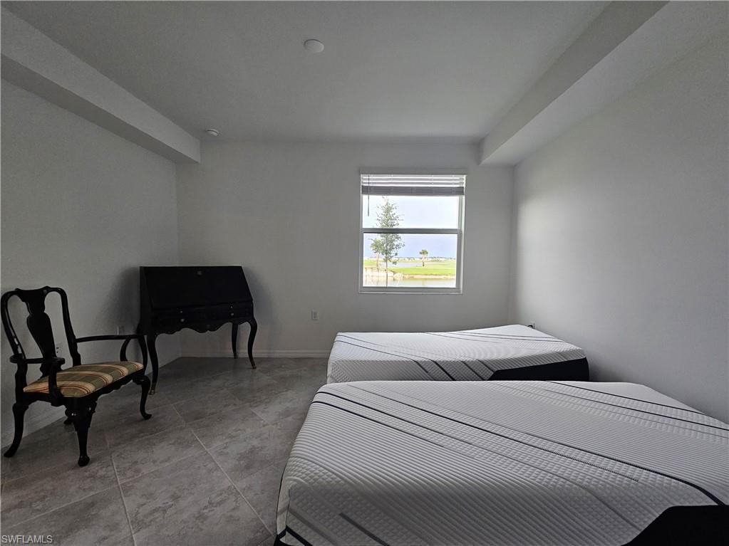 5835 Double Eagle Circle, Unit 4711 Immokalee, FL 34142 - Photo 7 of 44 a bedroom with a bed and a window
