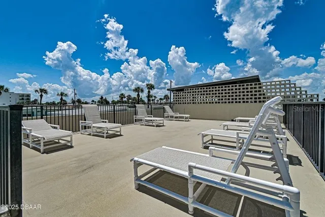 a view of a balcony with an ocean