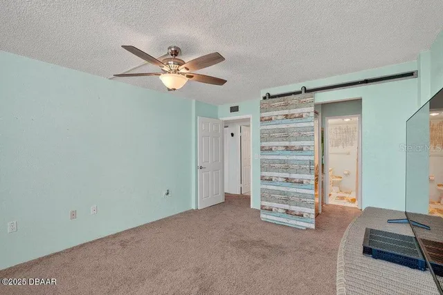 a view of a room with a flat screen tv