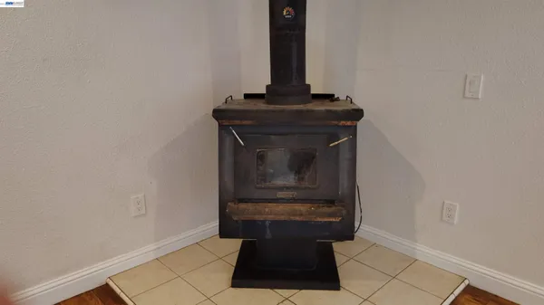 a kitchen with granite countertop wooden cabinets stainless steel appliances and a window