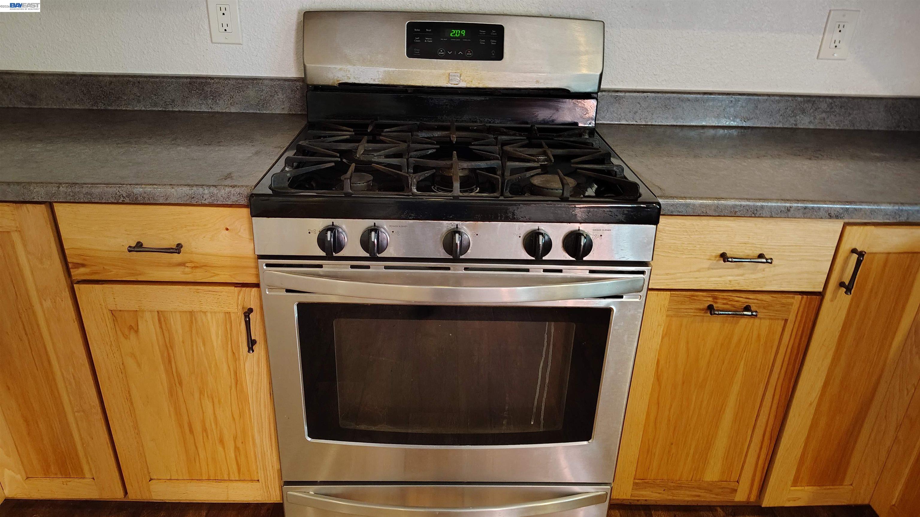 28440 Ryan Creek Road Willits, CA 95490 - Photo 10 of 22 a stove top oven sitting inside of a kitchen
