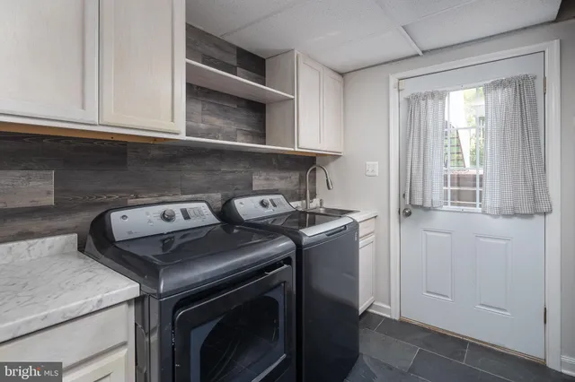 a view of a deck with wooden floor and fence