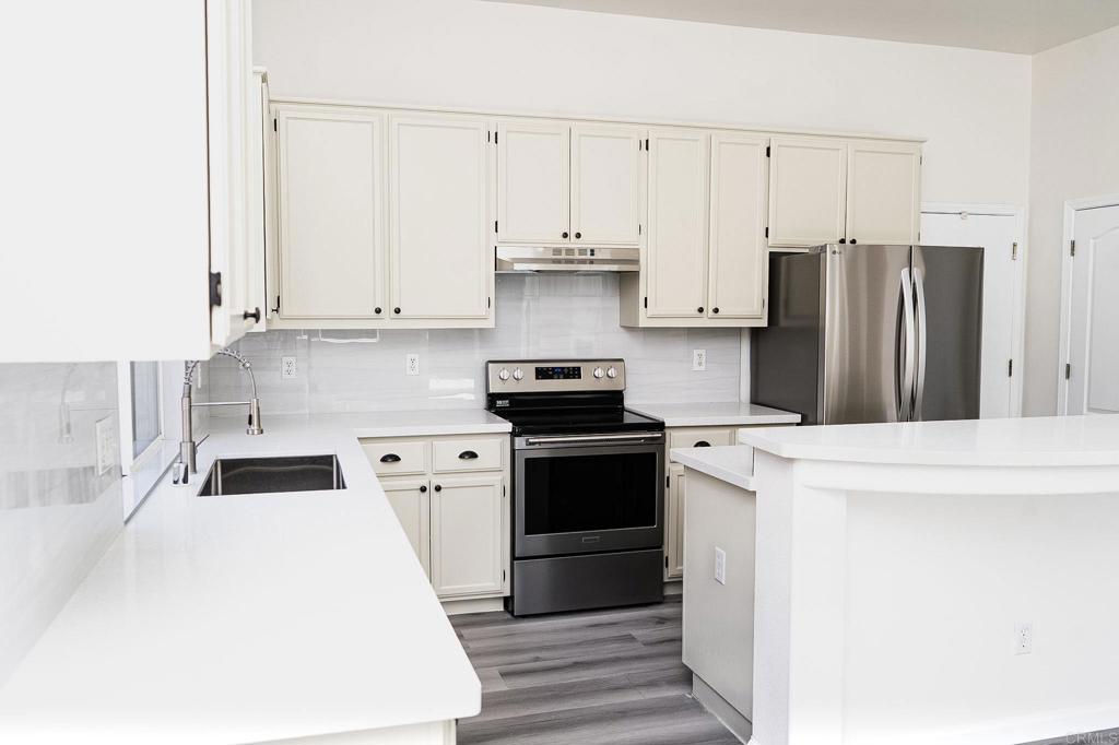 3005 Litt Road Modesto, CA 95355 - Photo 20 of 53 a kitchen with a refrigerator and a stove