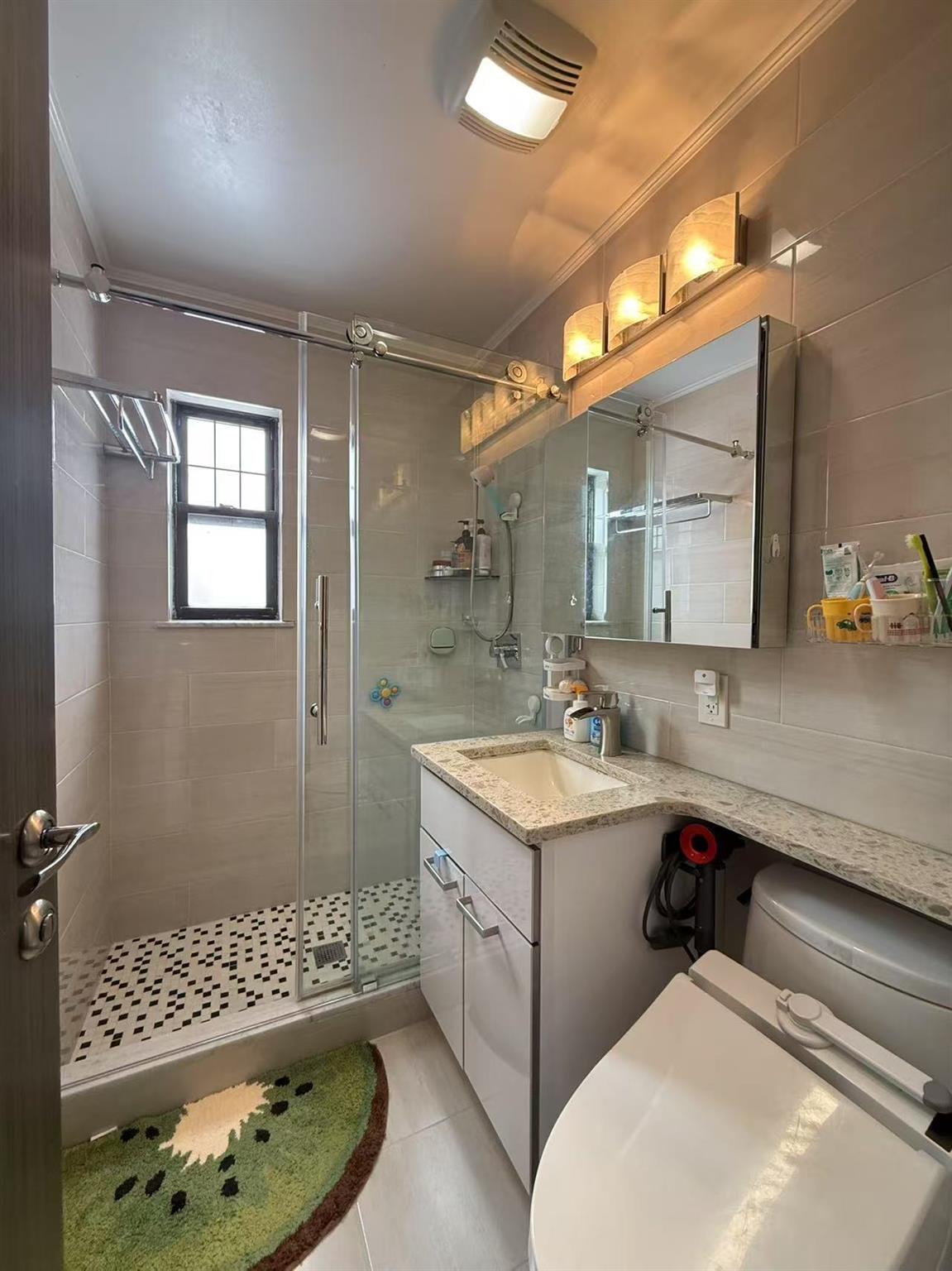 137-03 68th Drive, Unit B Queens, NY 11367 - Photo 12 of 13 Bathroom featuring tile patterned floors, an enclosed shower, tile walls, ornamental molding, and vanity
