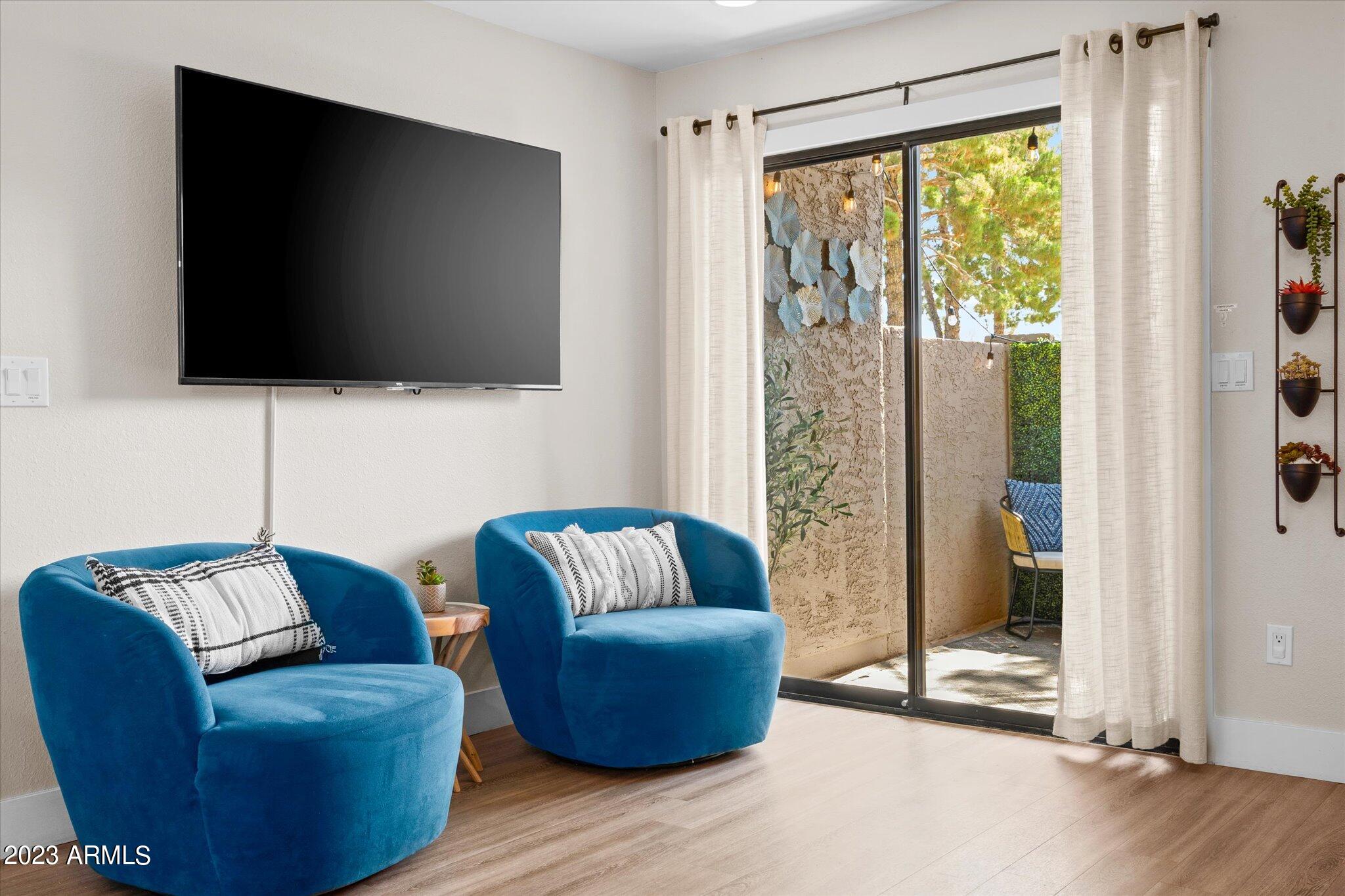 533 West Guadalupe Road, Unit 1024 Mesa, AZ 85210 - Photo 11 of 60 a living room with furniture and a flat screen tv