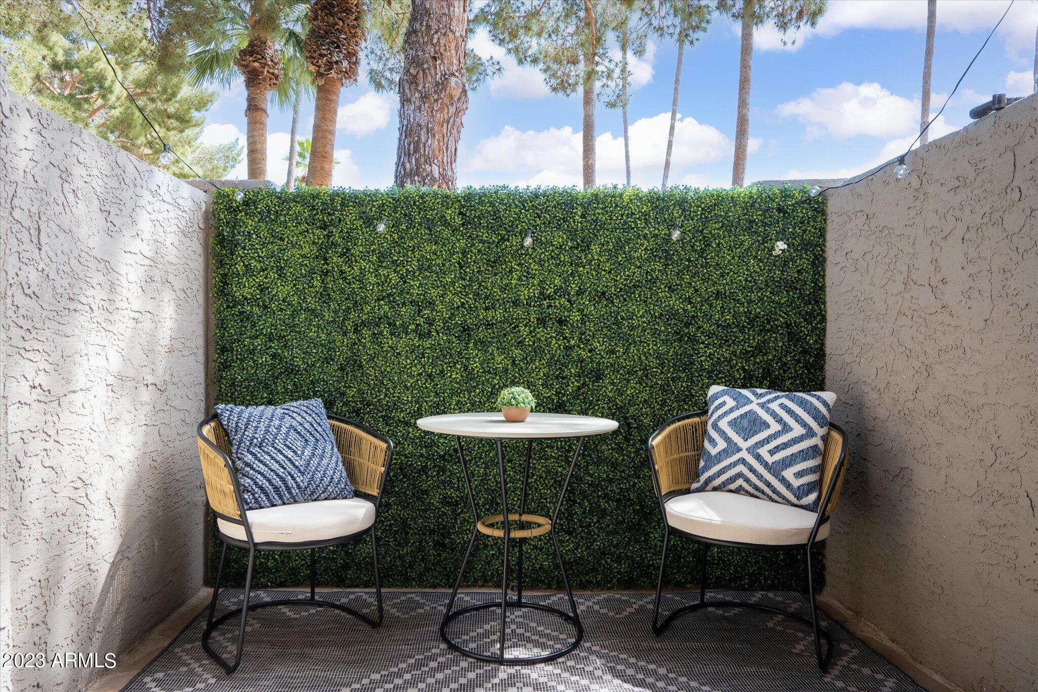 533 West Guadalupe Road, Unit 1024 Mesa, AZ 85210 - Photo 13 of 60 a view of a chairs and table in backyard