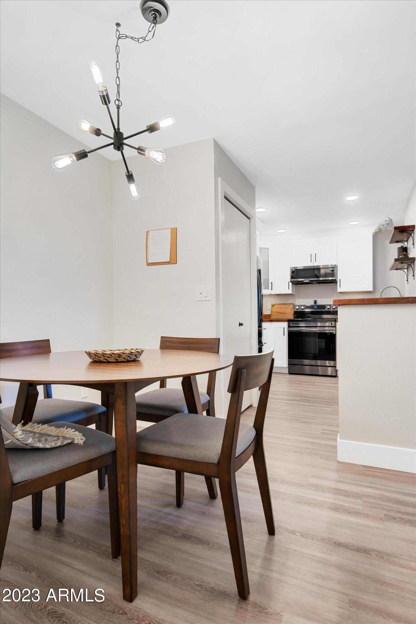533 West Guadalupe Road, Unit 1024 Mesa, AZ 85210 - Photo 14 of 60 a view of a dining room with furniture