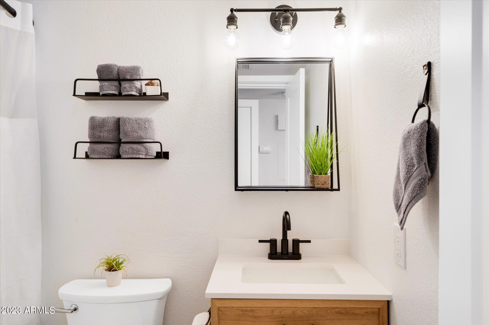 533 West Guadalupe Road, Unit 1024 Mesa, AZ 85210 - Photo 29 of 60 a bathroom with a sink and a mirror