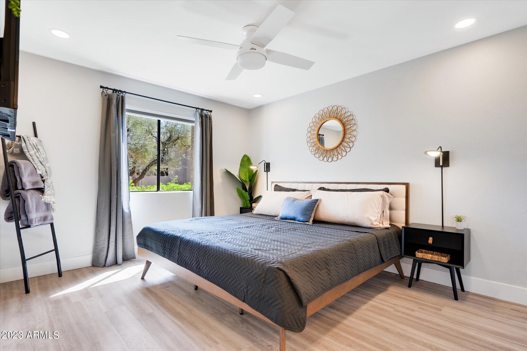 533 West Guadalupe Road, Unit 1024 Mesa, AZ 85210 - Photo 32 of 60 a bedroom with a bed and a table