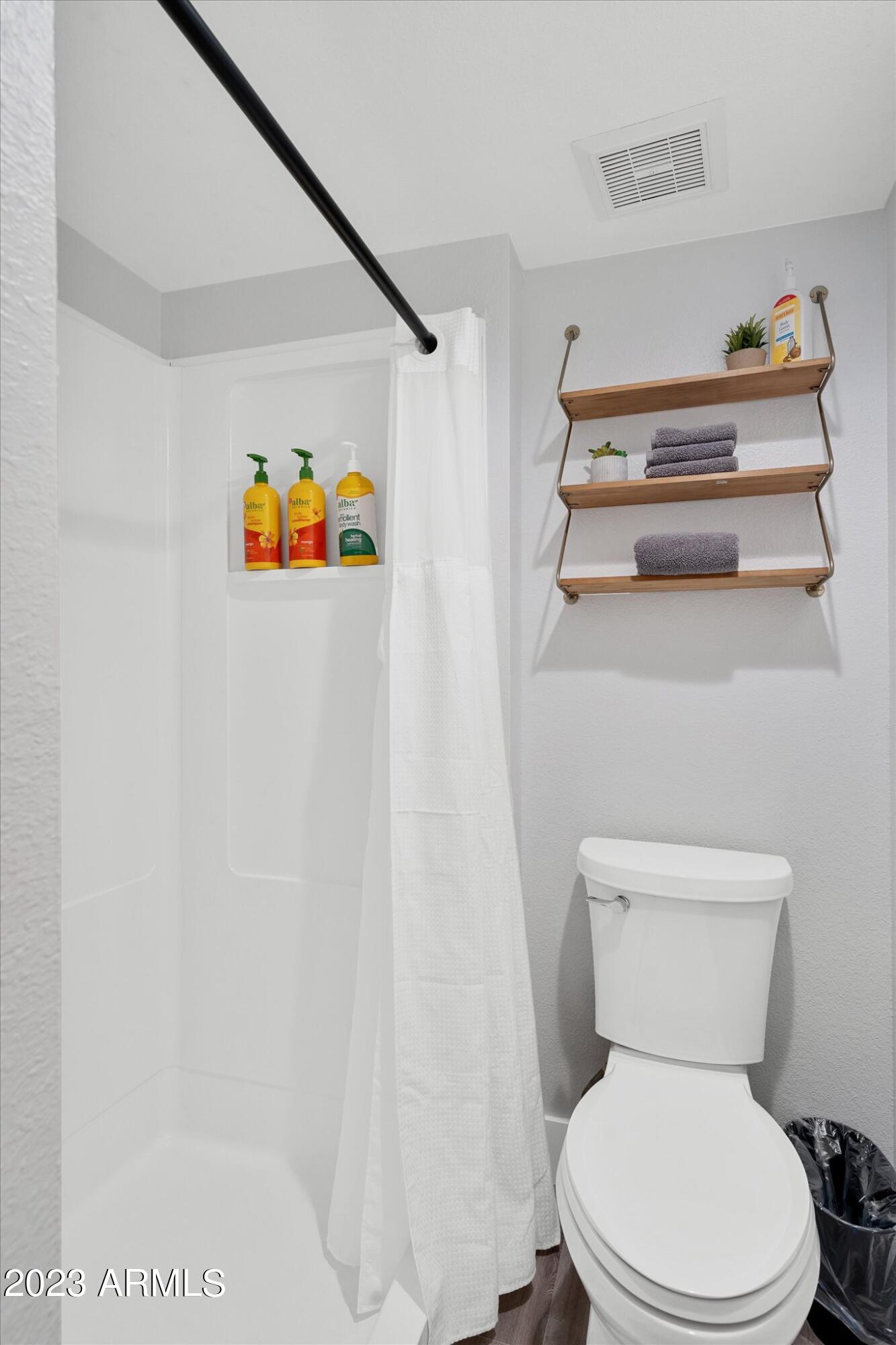 533 West Guadalupe Road, Unit 1024 Mesa, AZ 85210 - Photo 39 of 60 a white toilet sitting next to a bathroom sink