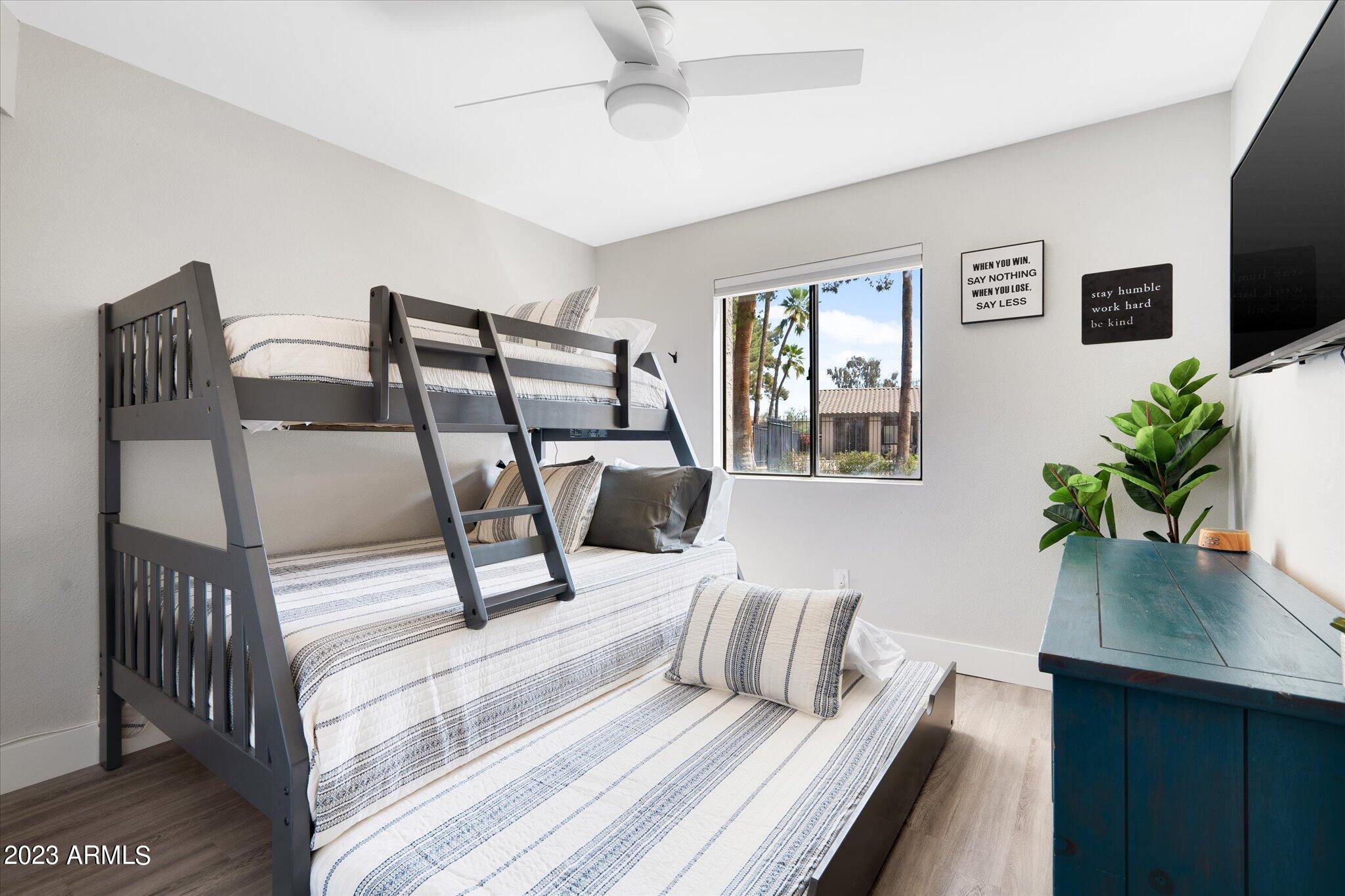 533 West Guadalupe Road, Unit 1024 Mesa, AZ 85210 - Photo 47 of 60 a living room with furniture and a flat screen tv