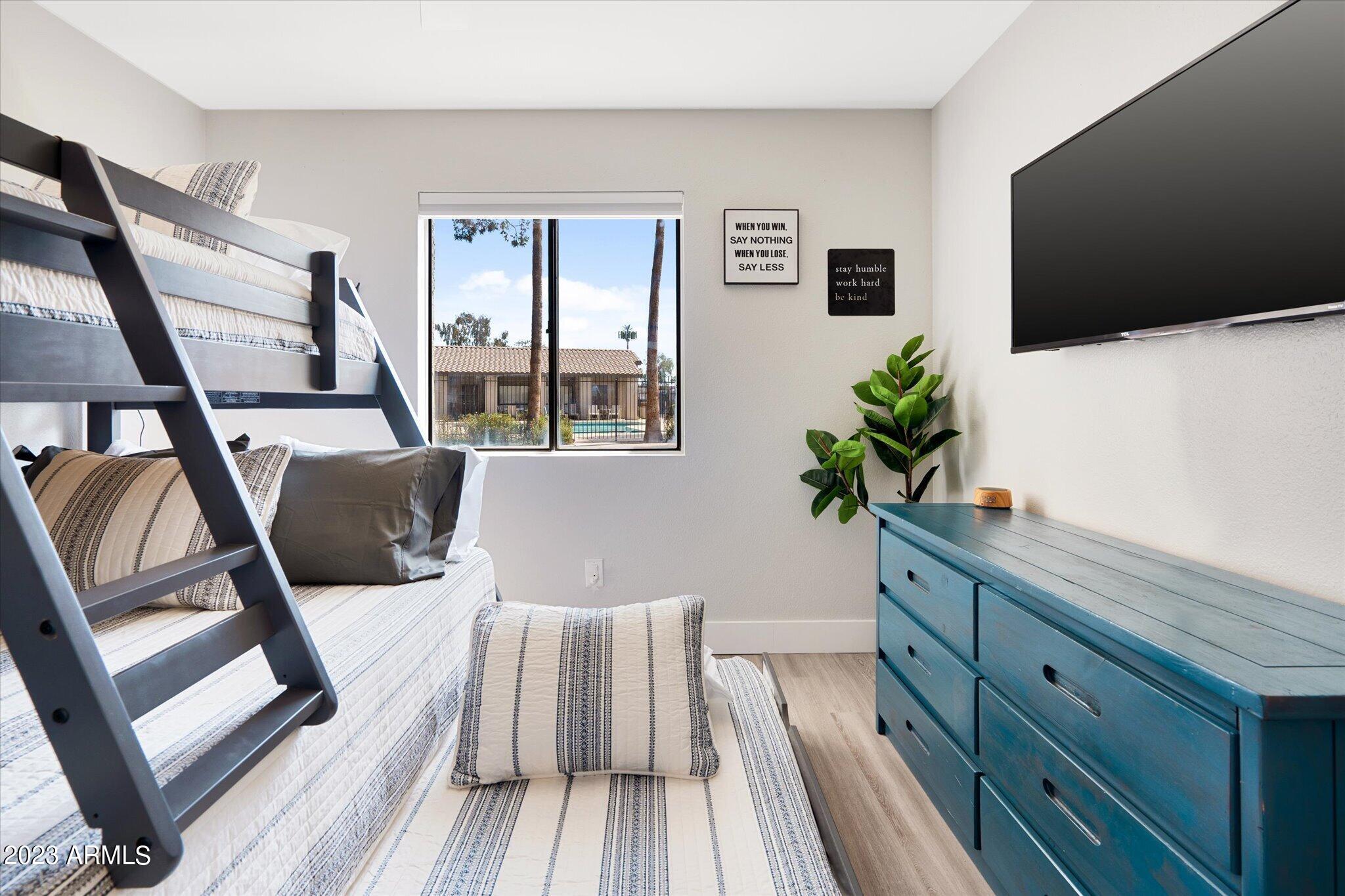 533 West Guadalupe Road, Unit 1024 Mesa, AZ 85210 - Photo 48 of 60 a living room with furniture and a flat screen tv