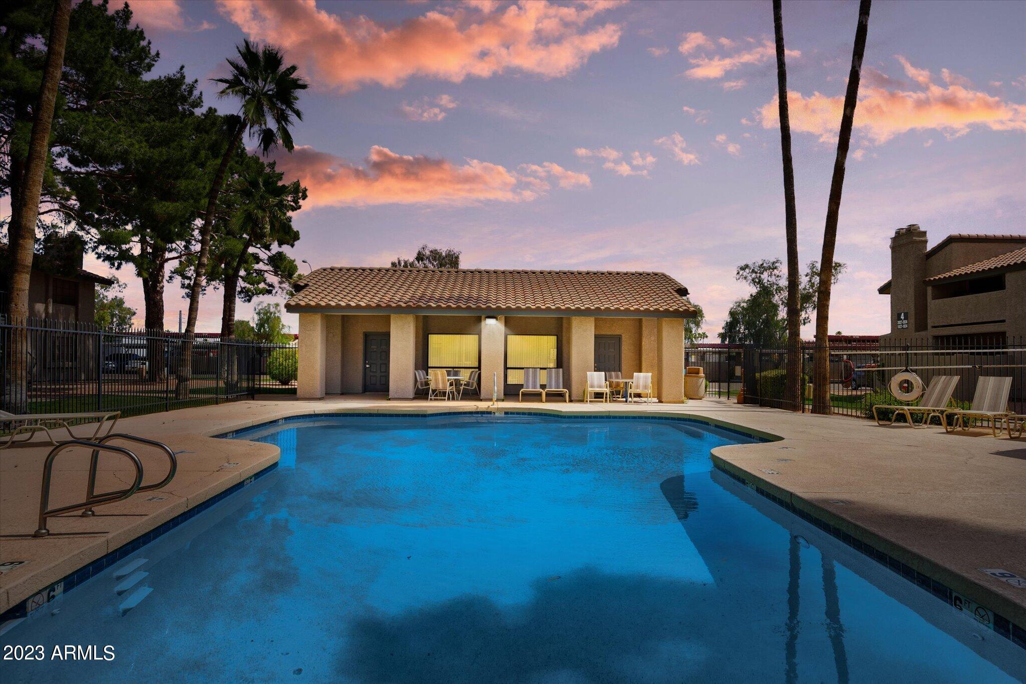533 West Guadalupe Road, Unit 1024 Mesa, AZ 85210 - Photo 53 of 60 a view of house with swimming pool yard and outdoor seating