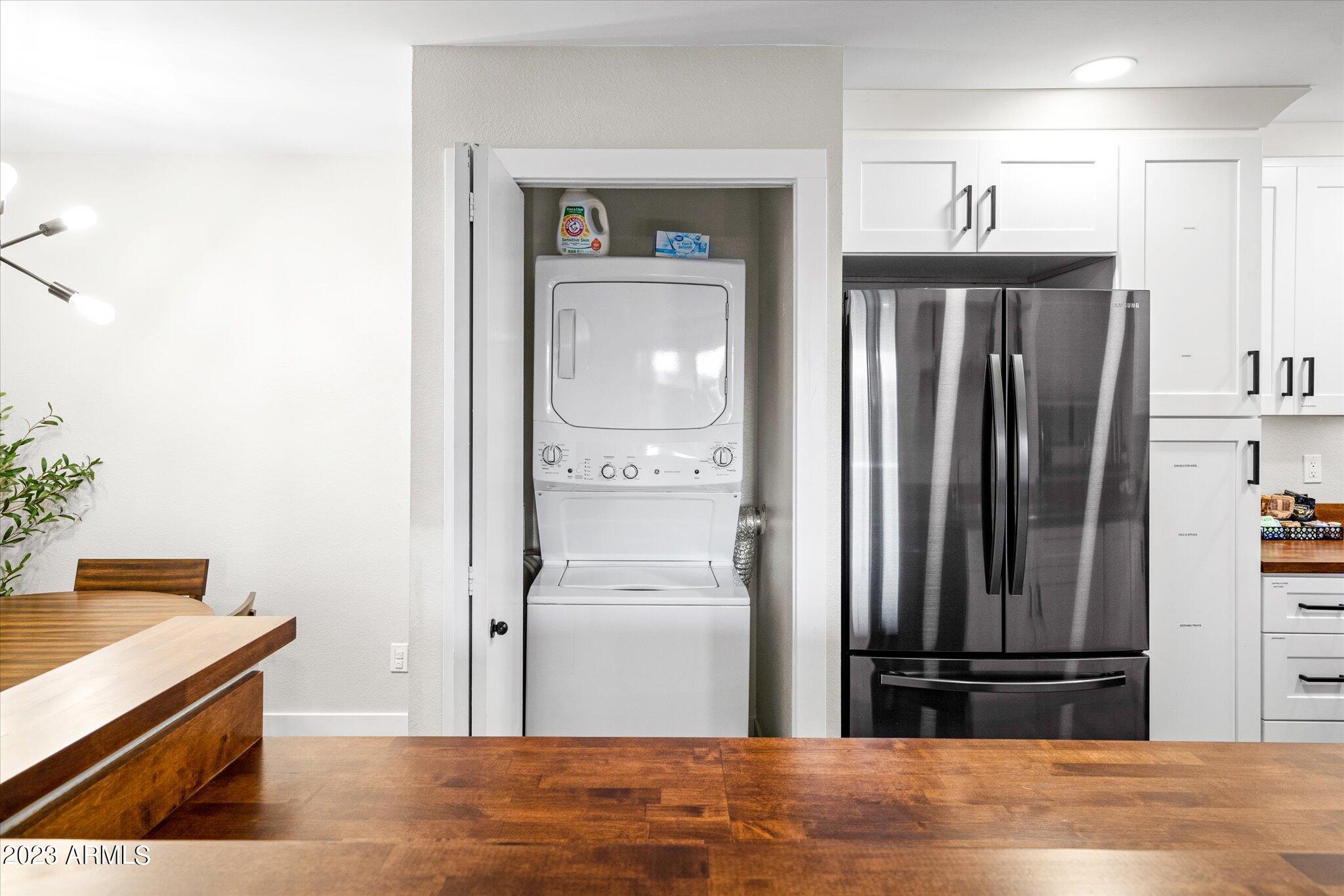 533 West Guadalupe Road, Unit 1024 Mesa, AZ 85210 - Photo 6 of 60 a view of a kitchen from the hallway