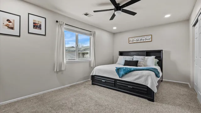 a bedroom with bed and window