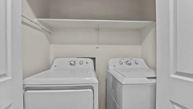 a utility room with dryer and washer