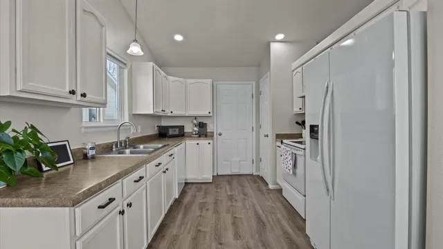 a kitchen with cabinets and stainless steel appliances