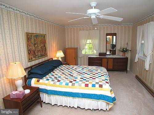 1902 Moore Road Forest Hill, MD 21050 - Photo 13 of 27 a bedroom with a bed mirror and a window
