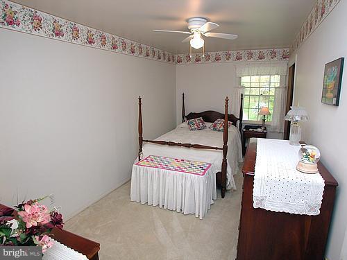 1902 Moore Road Forest Hill, MD 21050 - Photo 14 of 27 a bedroom with a bed mirror and window