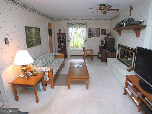 1902 Moore Road Forest Hill, MD 21050 - Photo 3 of 27 a living room with furniture and a flat screen tv
