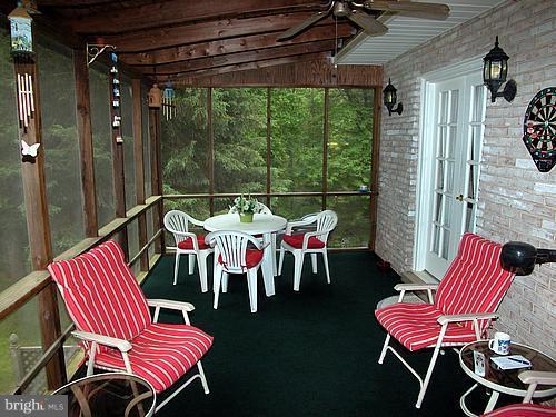 1902 Moore Road Forest Hill, MD 21050 - Photo 5 of 27 a patio with a table and chairs
