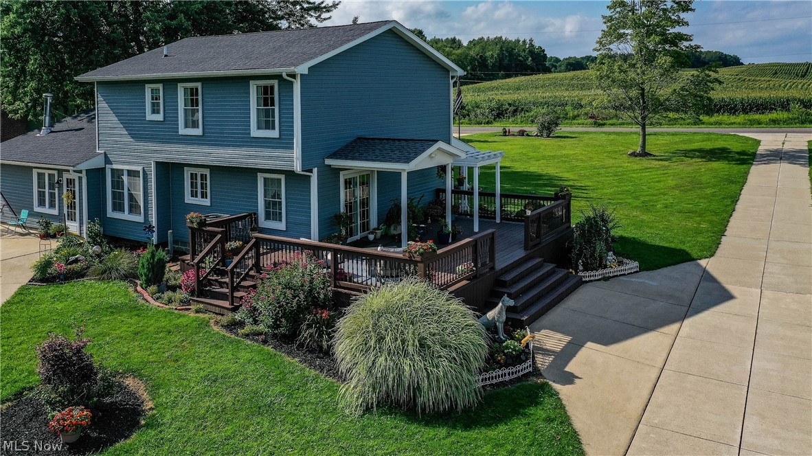 3770 Winchell Road Mantua, OH 44255 - Photo 3 of 34 Side of the home with large deck and beautiful landscaping.