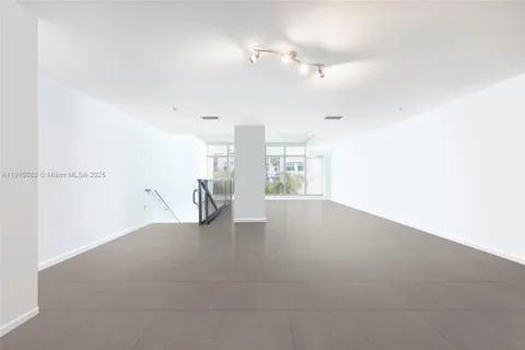 a view of a room with lots of white walls