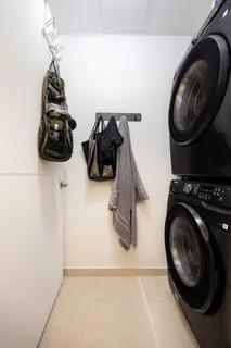 a bedroom with a bed and cabinets