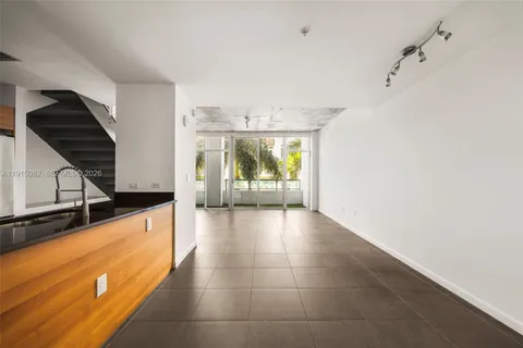 a view of balcony with a yard